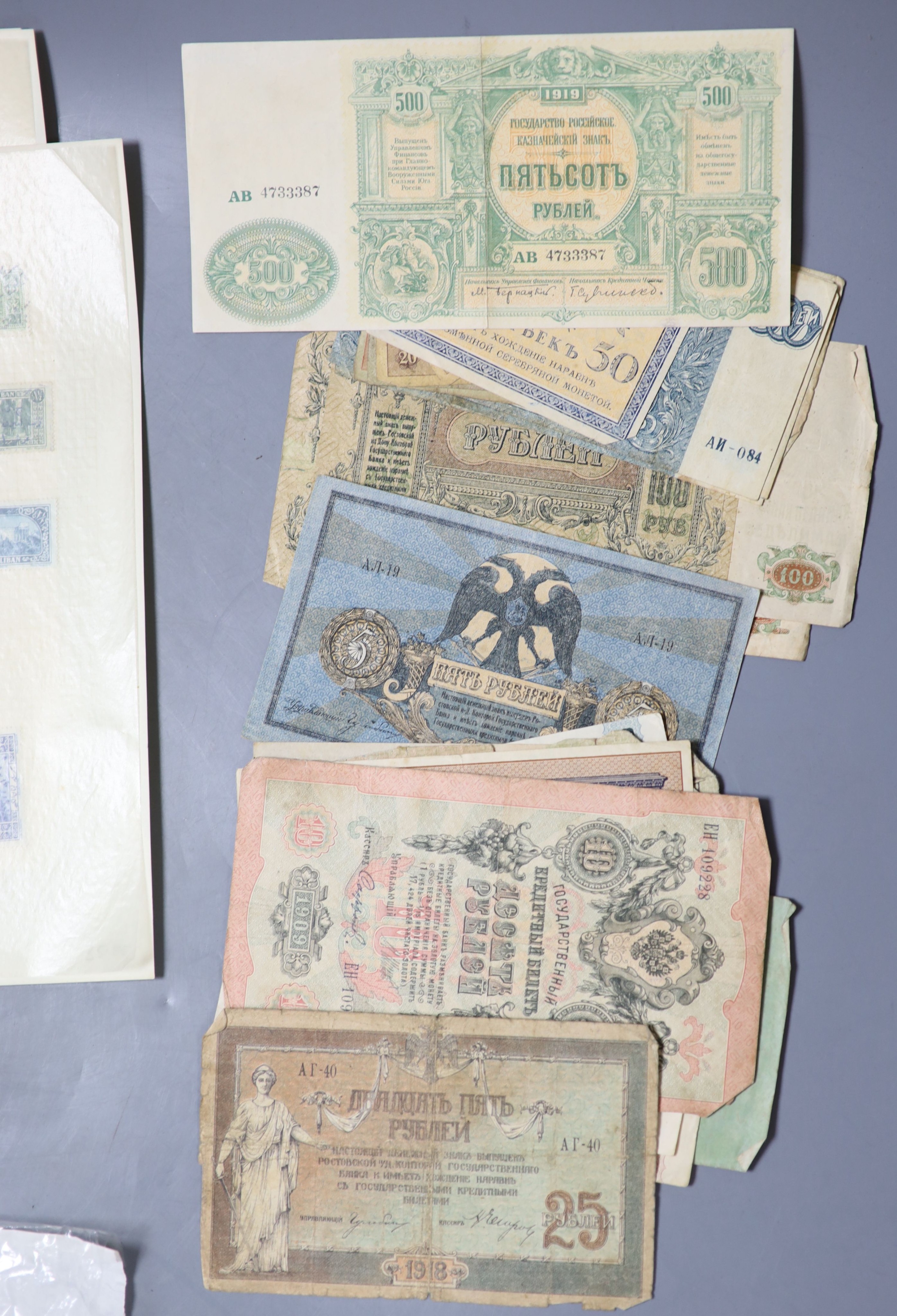 A collection of miscellaneous coins, stamps and banknotes